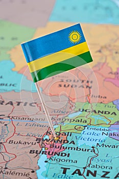 Rwanda flag pin on map photo