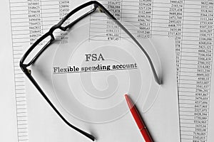 Paper with Flexible Spending Account FSA on a table