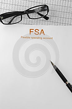 Paper with Flexible Spending Account FSA on a table