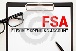 Paper with Flexible Spending Account FSA on a table