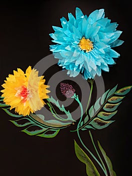 Paper flowers on a black background.