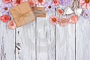 Paper flowers top border with Mother`s Day gift and tag over wood