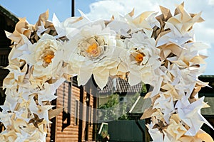 Paper flowers in wedding decor, luxury wedding decorations for ceremony. Wedding arch