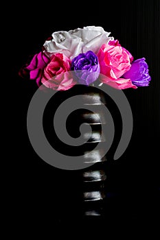 Paper flowers in wooden vase