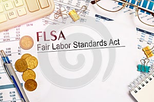 Paper with FLSA Fair Labor Standards Act on a tabl