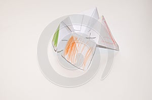 A paper fortune teller with green, orange and red colors - DIY toys