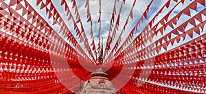 Paper garlands used to make a peculiar formation on the top of a temple during devotional festival ceremony