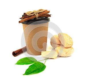 Paper glass, marshmallows, zephir, cinnamon and green leaves isolated on white background