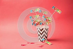 Paper glass party on a pink background. Beach cheers celebration