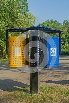 paper , glass and plastic waste bins .