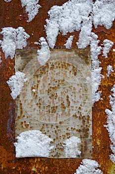 Paper on a grunge wall in snow