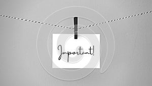Paper hanging on a rope with a brooch with the phrase important. Inspirational quote.  Thank you card, banner, poster or design.