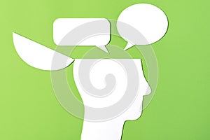 Paper head with two speech bubbles