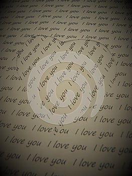 Paper heart cut a sheet full of love words