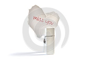 Paper heart saying miss you