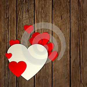 Paper heart on the wooden background