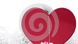 paper hearts harland red color isolated on snow ice