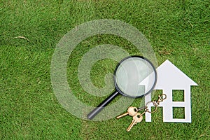 Paper house and key with Magnifying Glass, Green Living hunting