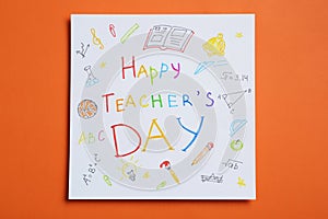Paper with inscription HAPPY TEACHER`S DAY on orange background