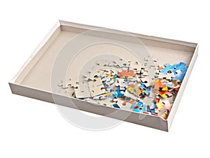 Paper jigsaw puzle in box isolated photo