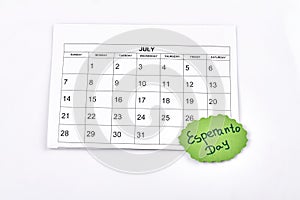 Paper july calendar and esperanto day message.