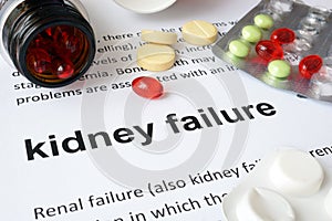Paper with kidney failure and pills. photo