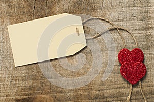 Paper label with rope and red hearts