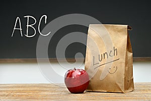 Paper lunch bag on desk