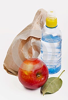 Paper lunch bag with red apple