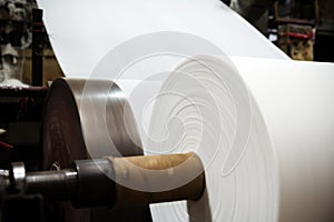 The paper machine in the factory are making paper