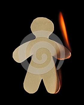 Paper man with arm and leg burn in flame