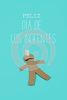 Paper man and text happy innocents day in spanish