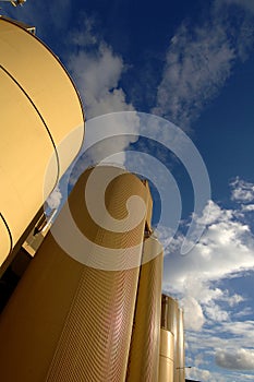 Paper manufacturing premise Norske Skog-exterior image showing storage silos and conveyor