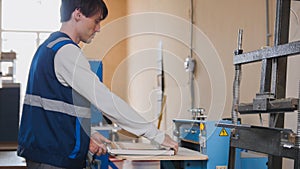 A paper mill worker prints a magazine