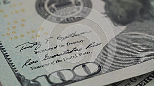 Paper money rotation. The background with the money of the American hundred dollar bills turns counterclockwise. Close