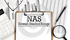 Paper with NAS - Network Attached Storage a table on charts, business concept photo