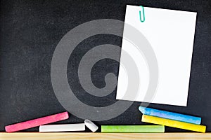 paper note on black board. blank notes. sticker note empty space for add text