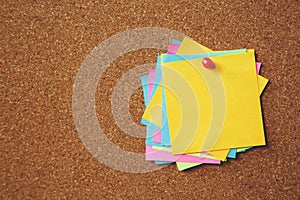 Paper note pad reminder sticky notes pin paper yellow on cork bulletin board