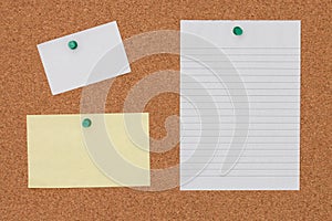 Paper note with pushpin on cork board background