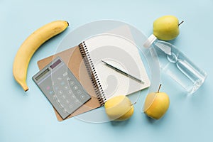 Paper notebook with calculator and pen