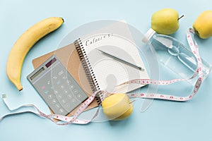 Paper notebook with calculator and pen