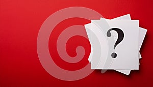 Paper notes with question marks on red background, flat lay. Space for text