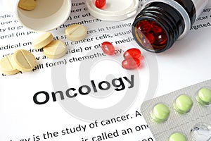 Paper with Oncology and pills.