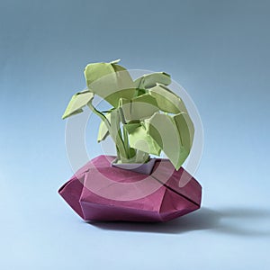 paper origami flower on a light blue background