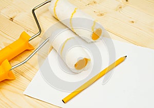 Paper with pencil and platen for paint on wooden