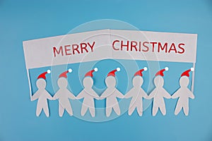 Paper people holding a sign. christmas concept