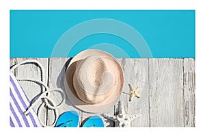 Paper photo. Beach accessories on wooden deck near outdoor swimming pool, flat lay