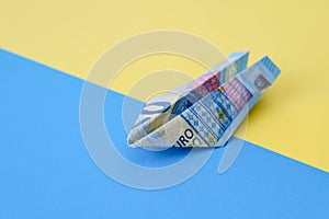 Paper plane from euro banknotes