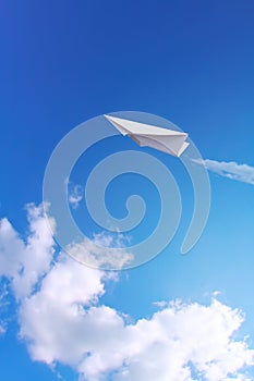 Paper plane in sky