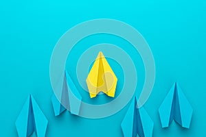 Paper planes over turquoise blue background with copy space leadership concept. Flat lay image of competition business concept. 